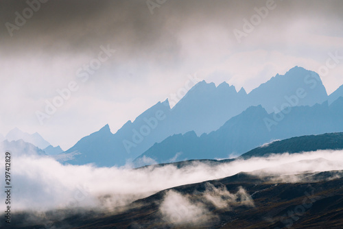 Dramatic light with silhouette of mountains 