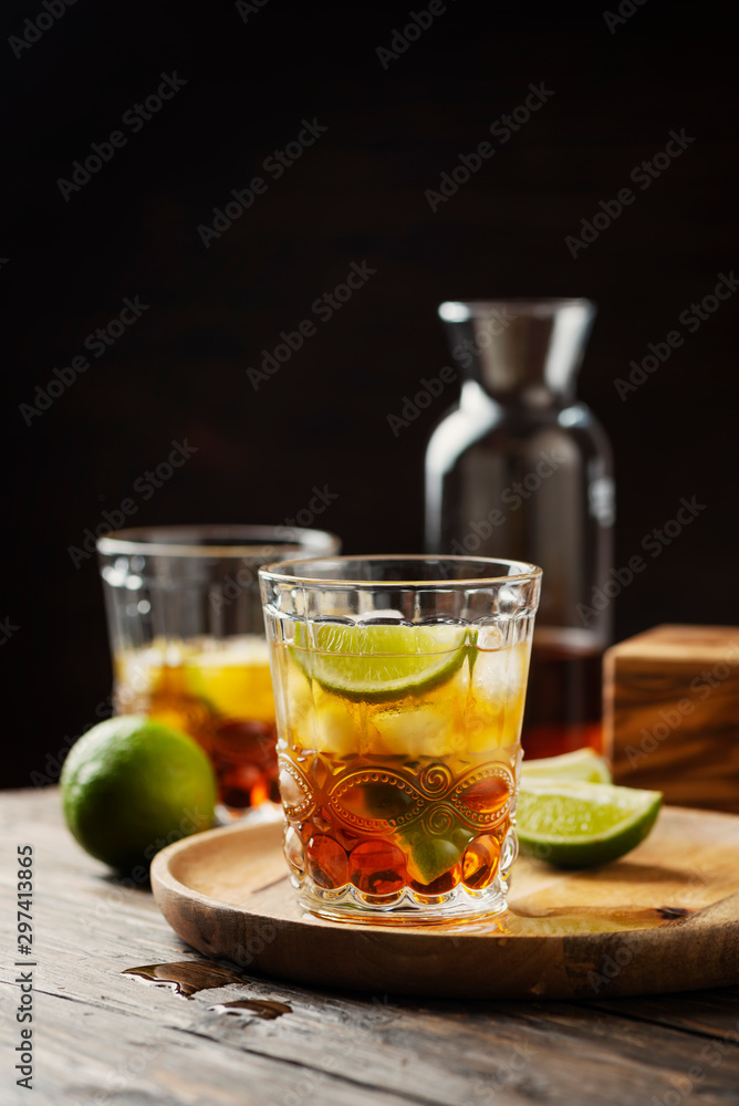 Strong golden rum with lime and ice Strong golden rum with lime and ice