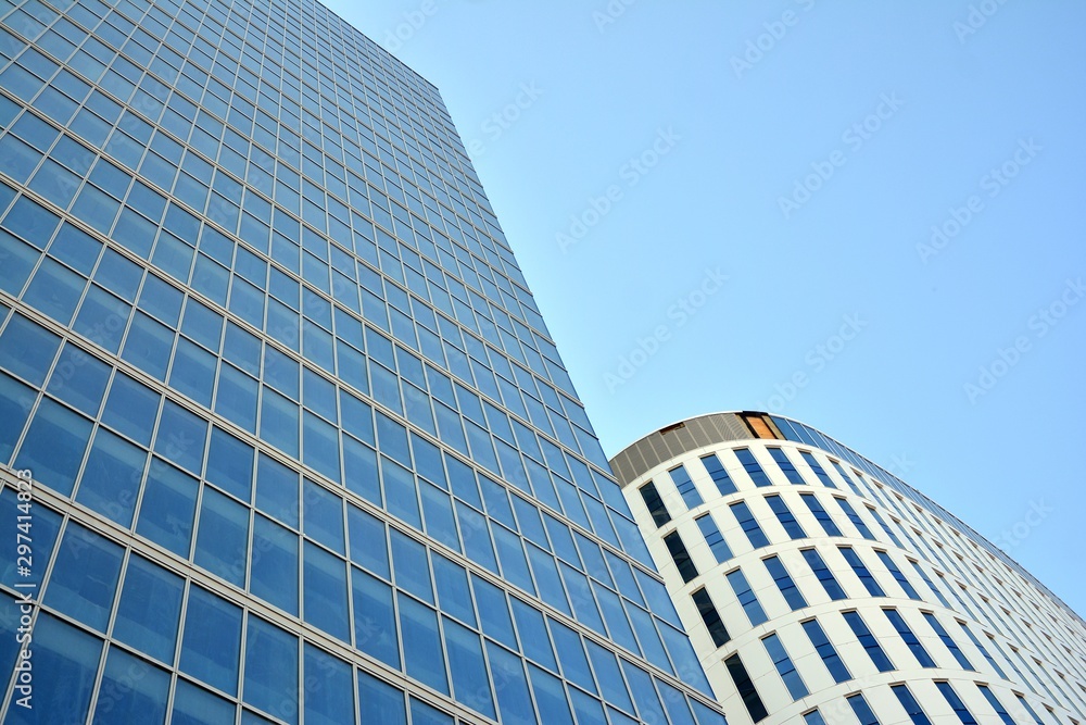 Panoramic and perspective wide angle view to steel light blue background of glass office building commercial modern city of future. Business concept of success industry tech architecture. 