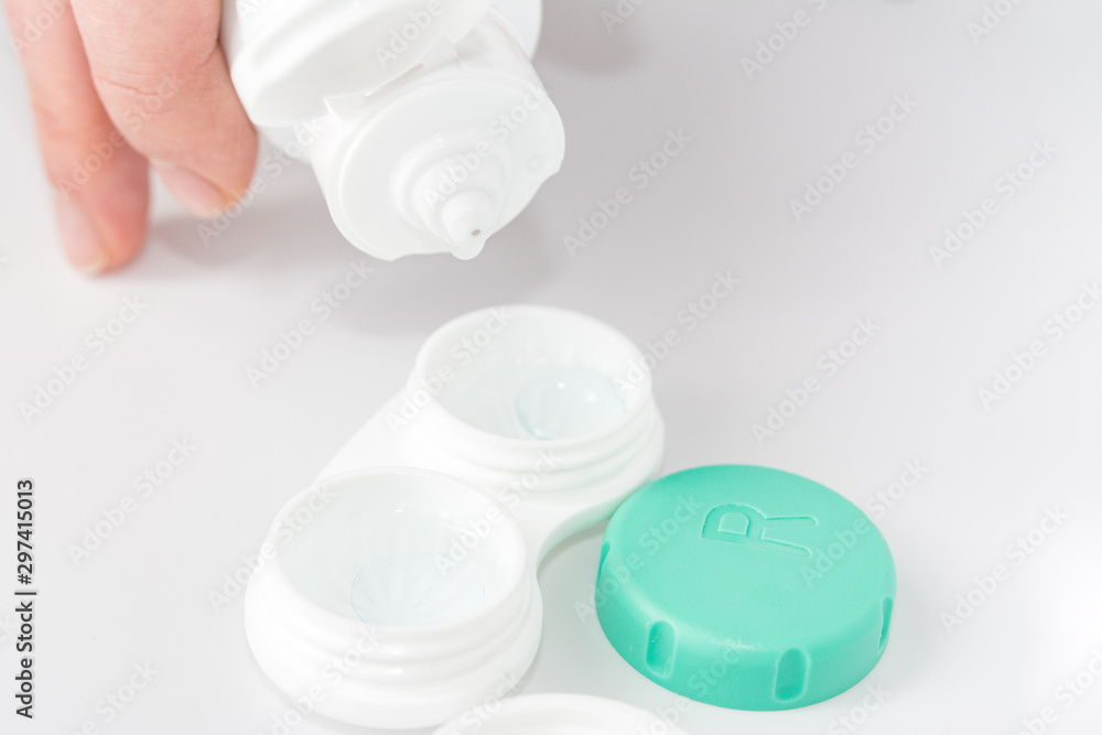 the solution for processing and storage of soft contact lenses is poured into a storage container, the concept of care for contact lenses the solution for processing and storage of soft contact lenses is poured into a storage container, the concept of care for contact lenses
