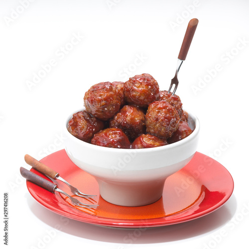meatballs in a bowl with cocktail forks