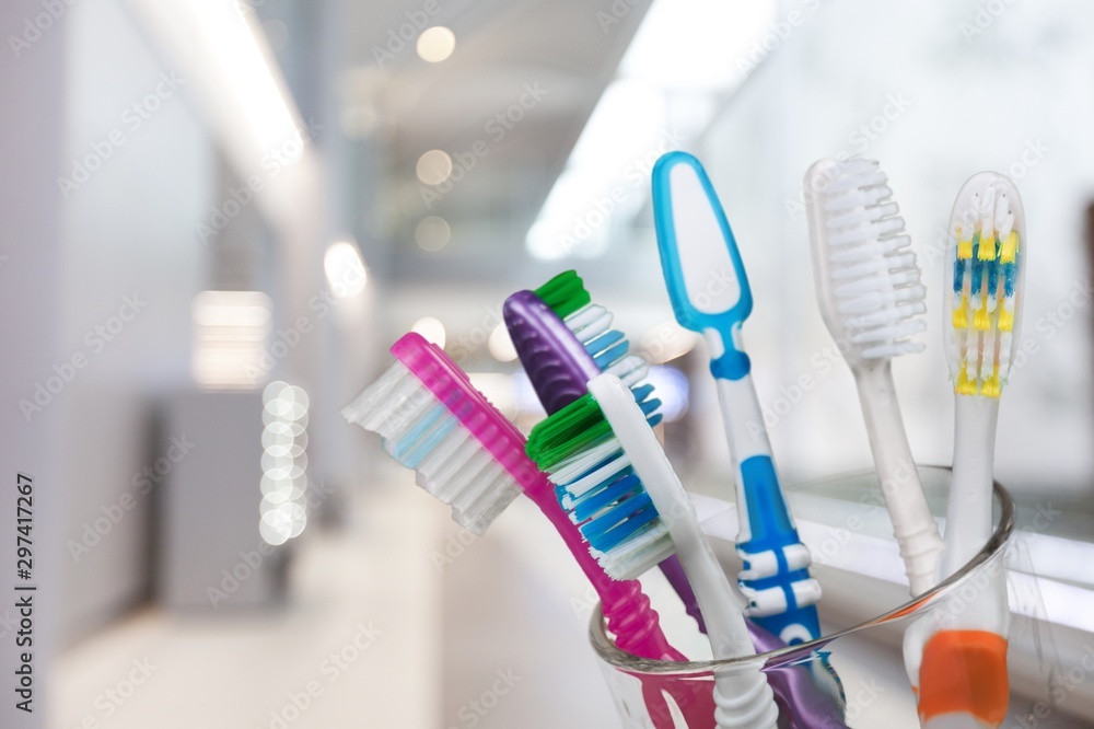 New Colorful Toothbrushes on light Background
