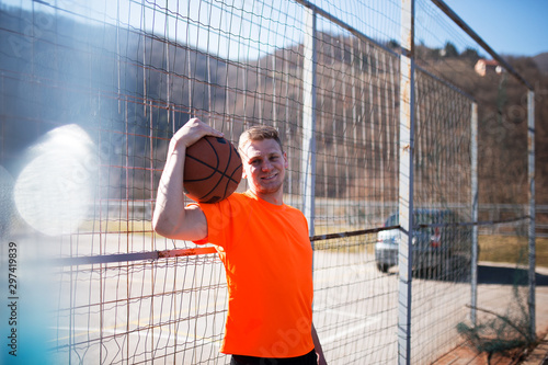 Street basketball player holding ball © Novak