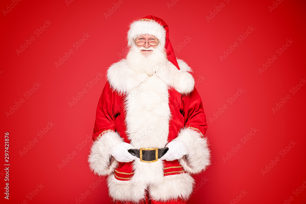 Real Santa Claus on red studio background. Real Santa Claus on red studio background.