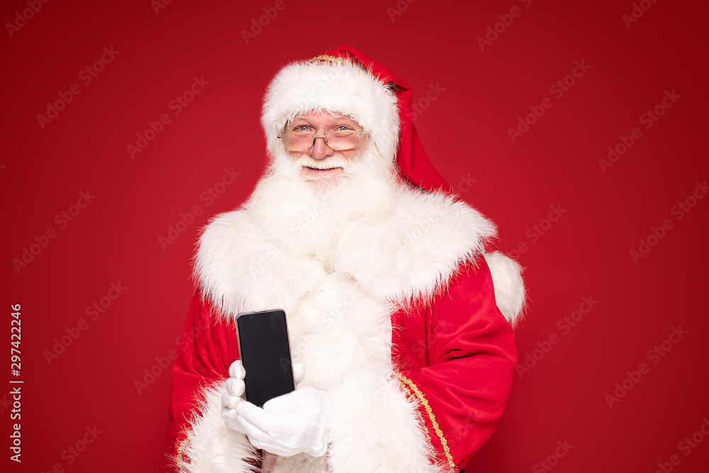 Real Santa Claus with mobile phone. Real Santa Claus with mobile phone.