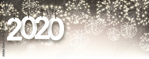 Gold 2020 New Year background with fireworks.