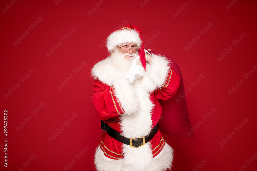 Real Santa Claus smiling,holding big gift bag. Real Santa Claus smiling,holding big gift bag.