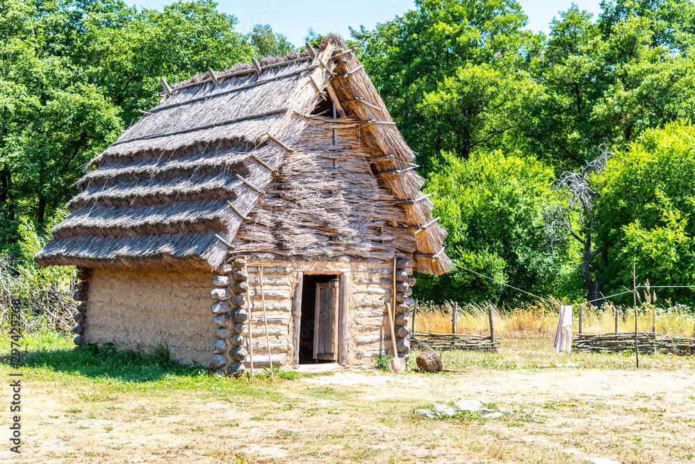 Small shepherd hut with straw roof on sunny day Small shepherd hut with straw roof on sunny day