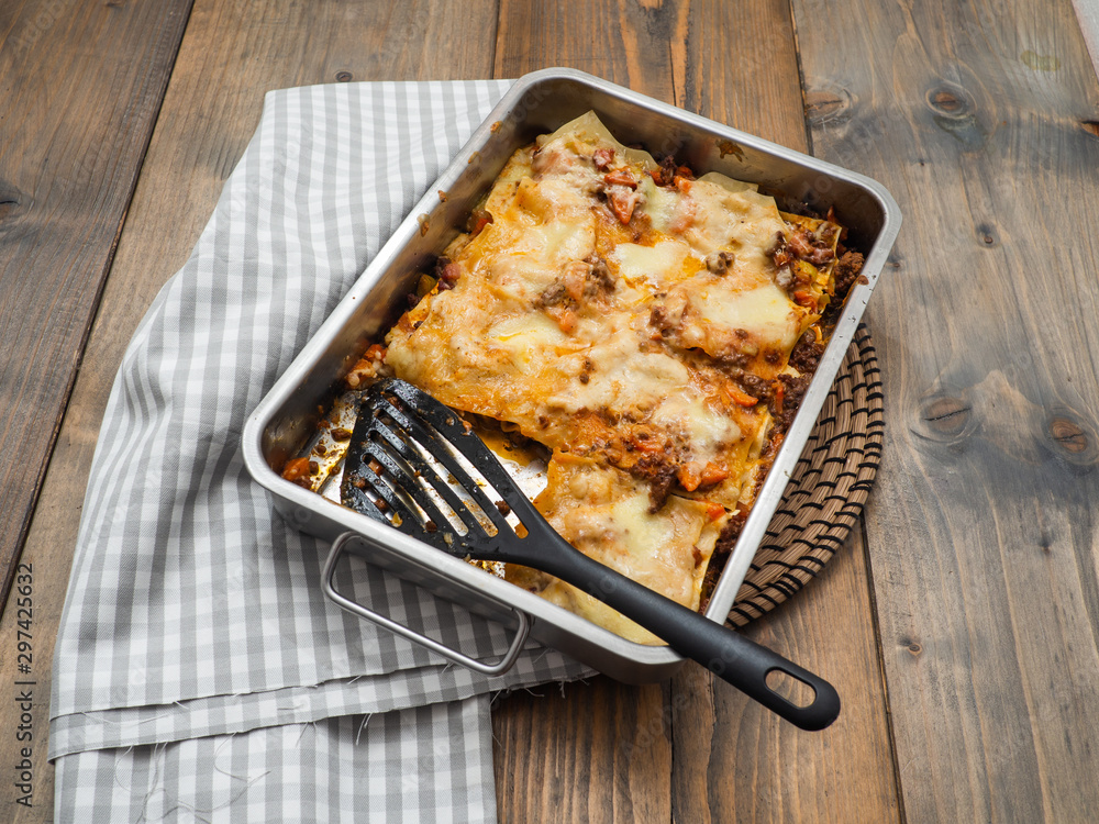 Top view of a whole lasagne in an ovenproof dish Top view of a whole lasagne in an ovenproof dish