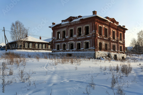 Abandoned historical residential house in winter. Village of Visim, Sverdlovsk region, Russia