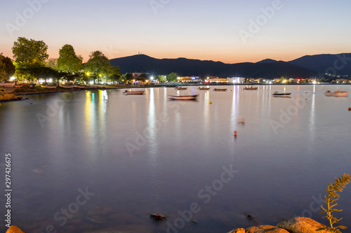 Fototapeta Naklejka Na Ścianę i Meble -  Sunset view of Coastal street of village of Stavros, Greece