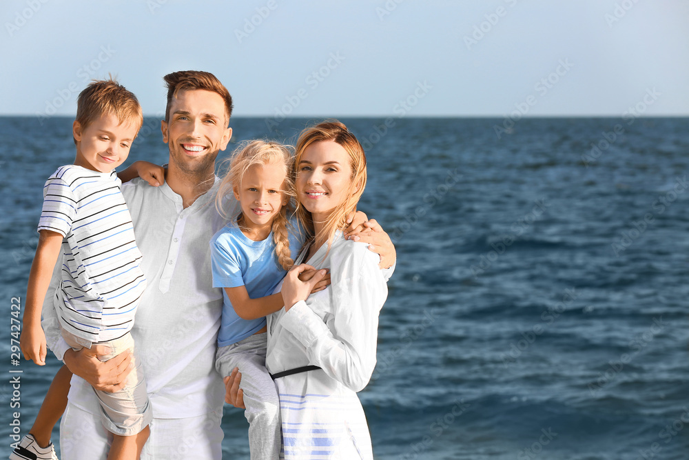 Portrait of happy family on sea beach Portrait of happy family on sea beach