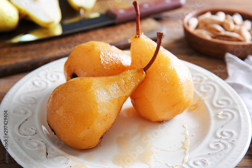 Tasty cooked pears on plate