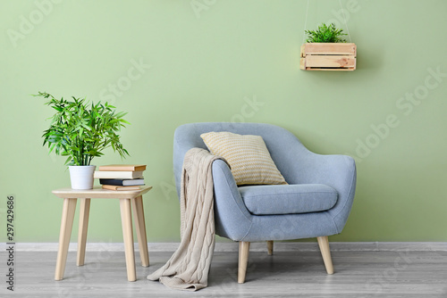 Interior of modern room with armchair and table