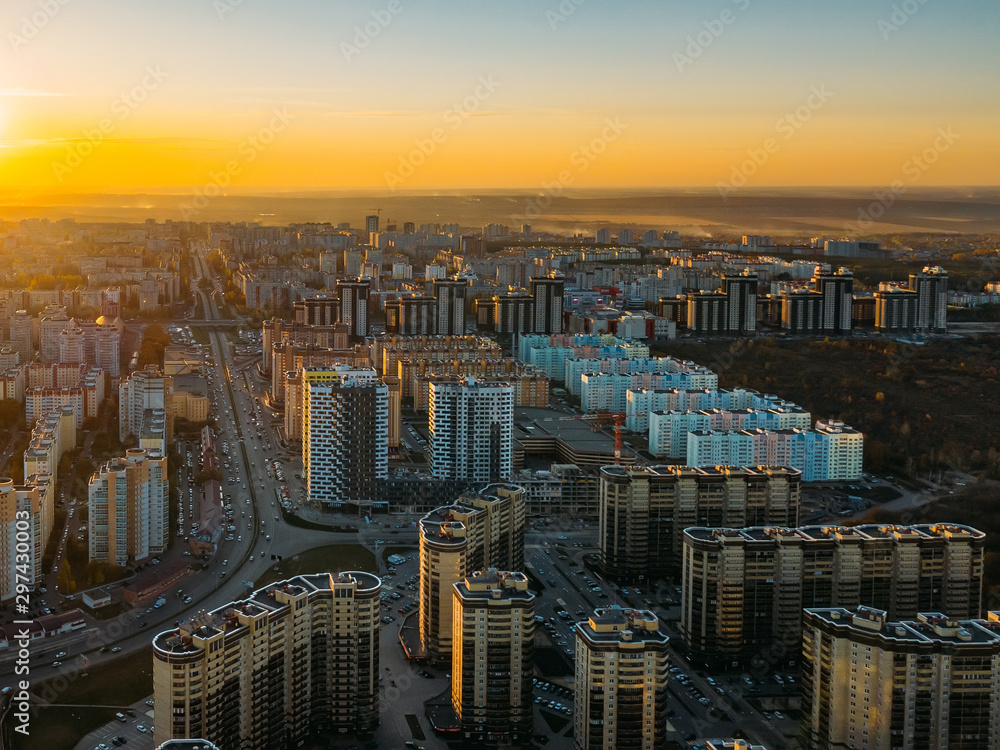 Sunset above modern residential area in Voronezh, aerial view from drone