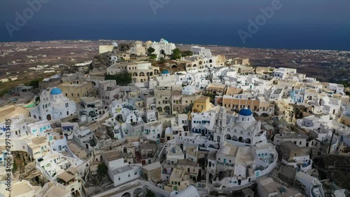 Wallpaper Mural Aerial drone video of iconic small traditional village and uphill castle of Pyrgos with great views to Santorini island Cladera, Cyclades, Greece Torontodigital.ca
