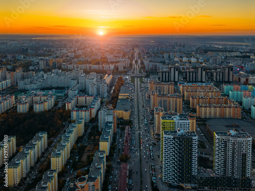 Sunset above modern residential area in Voronezh, aerial view from drone