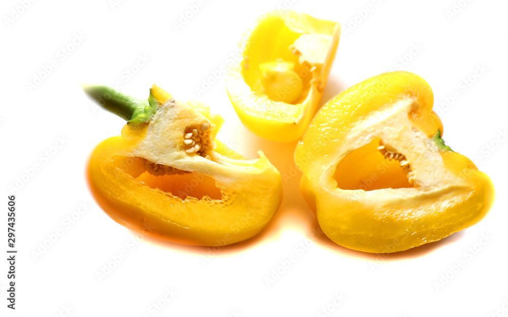 paprika, yellow pepper in a bowl isolated on white, source of vitamins