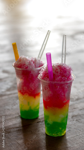Colorful smoothie ice in a clear glass.