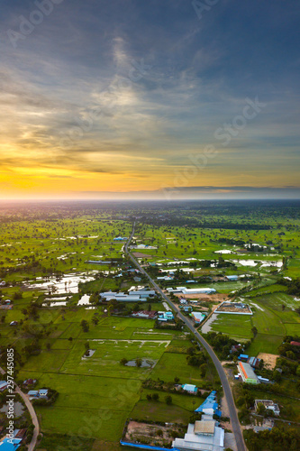 Top view Aerial photo from flying drone over Beautiful green rice field and village from above,Sisaket province,Thailand,ASIA.