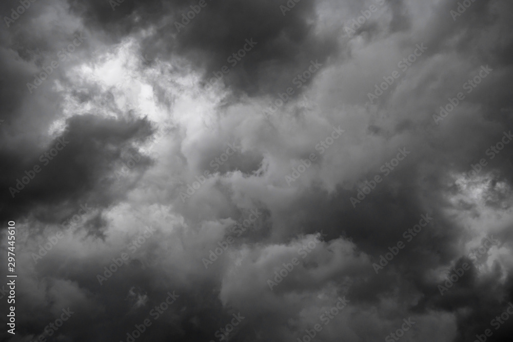 Dark sky and dramatic black cloud before rain.A tropical cyclone is a rapidly rotating storm system characterized by a low-pressure center, a closed low-level atmospheric circulation, strong winds. Dark sky and dramatic black cloud before rain.A tropical cyclone is a rapidly rotating storm system characterized by a low-pressure center, a closed low-level atmospheric circulation, strong winds.