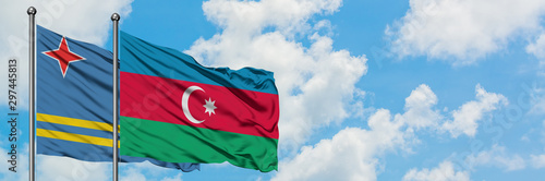 Aruba and Azerbaijan flag waving in the wind against white cloudy blue sky together. Diplomacy concept, international relations.