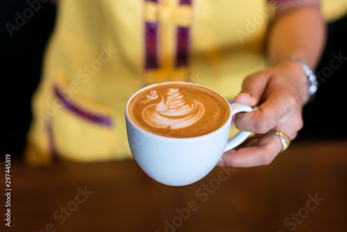 coffee cup latte art on blurred background.