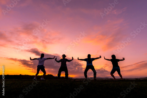 Group of healthy girl show hands with sunset background.Healthy exercise lifestyle concept.