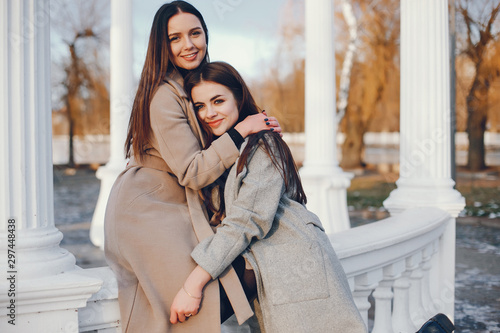 Fashionable girls in a winter city. Stylish ladies in a coats © hetmanstock2