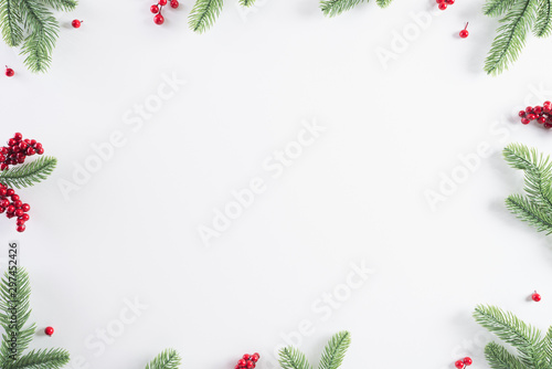 Wallpaper Mural Christmas background concept. Top view of Christmas gift box red balls with spruce branches, pine cones, red berries and bell on white background. Torontodigital.ca