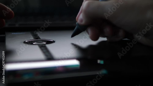 Person Browsing Web with Pen digital graphic Tablet. POV Close up Hands.
