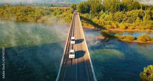 aerial view of bridges with mountains and lakes photo