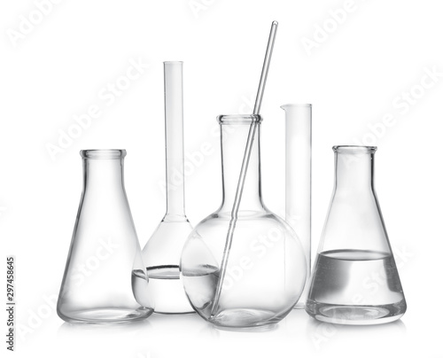 Laboratory glassware with liquid samples on white background © New Africa