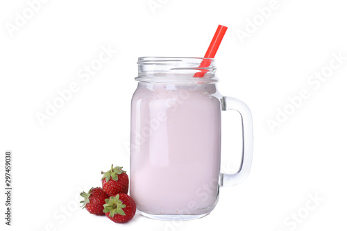 Tasty fresh milk shake in mason jar with strawberries on white background