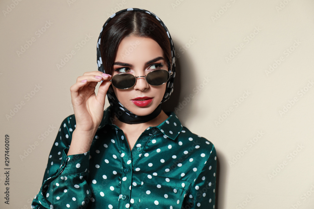 Beautiful woman in stylish sunglasses on beige background. Space for text Beautiful woman in stylish sunglasses on beige background. Space for text