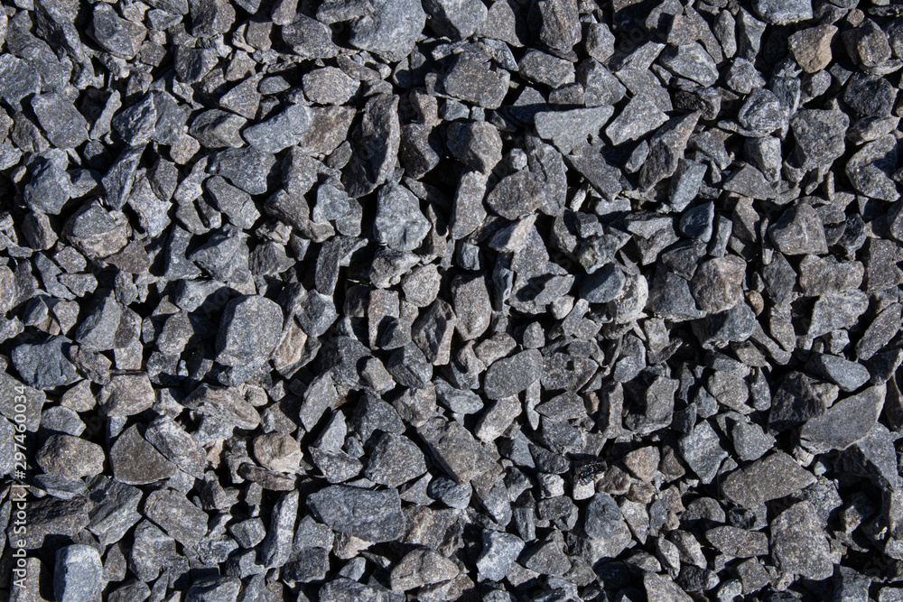 Cracked asphalt background.Black textured view.Road construction materials.Urban style.Black stones. Cracked asphalt background.Black textured view.Road construction materials.Urban style.Black stones.