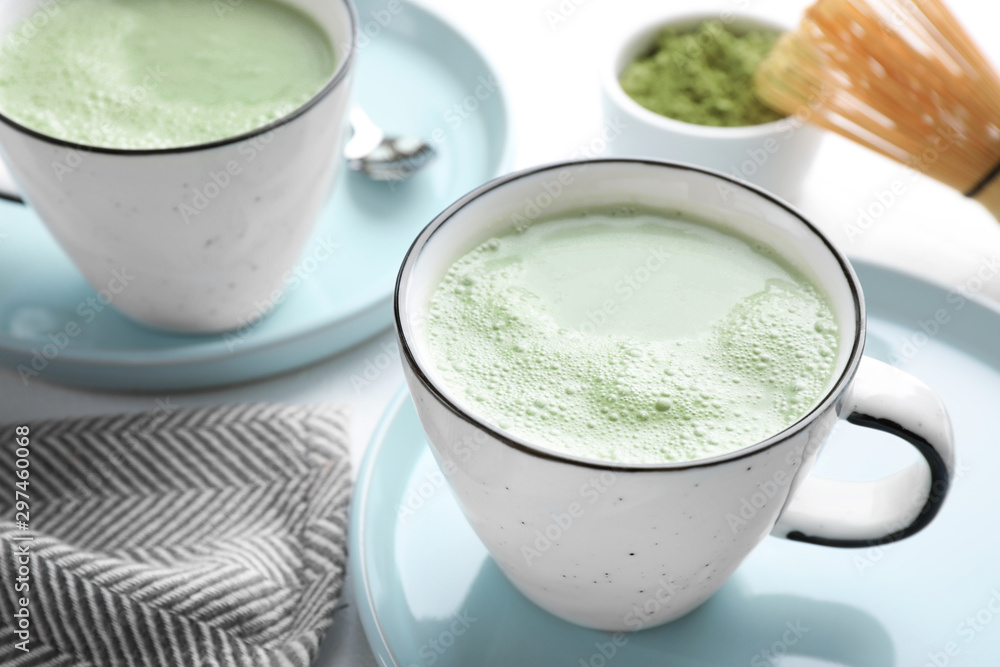 Tasty matcha green tea latte on white table, closeup Tasty matcha green tea latte on white table, closeup