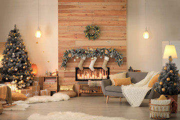 Stylish room interior with beautiful Christmas tree and decorative fireplace