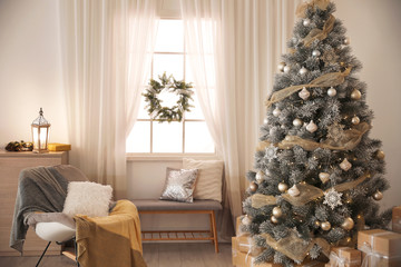 Beautiful interior of living room with decorated Christmas tree