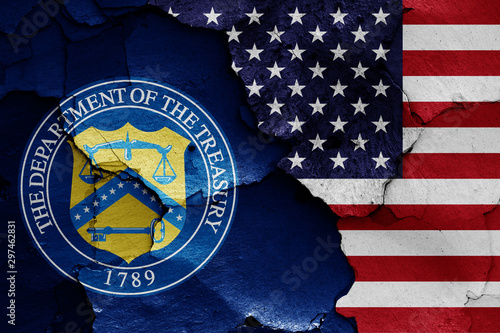 flags of Department of the Treasury and USA painted on cracked wall
