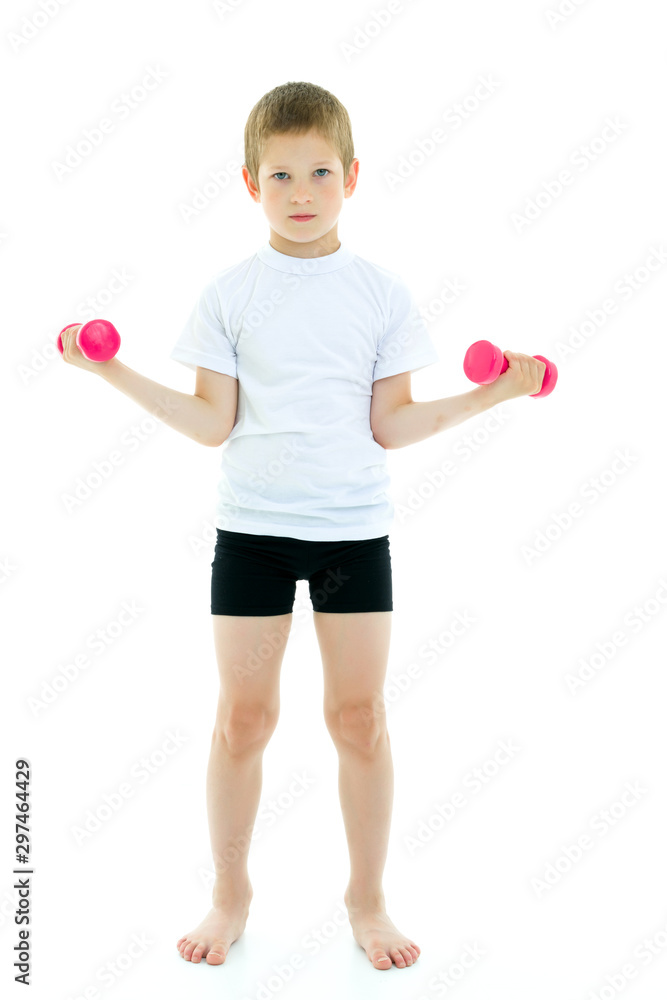 A little boy is lifting dumbbells. A little boy is lifting dumbbells.