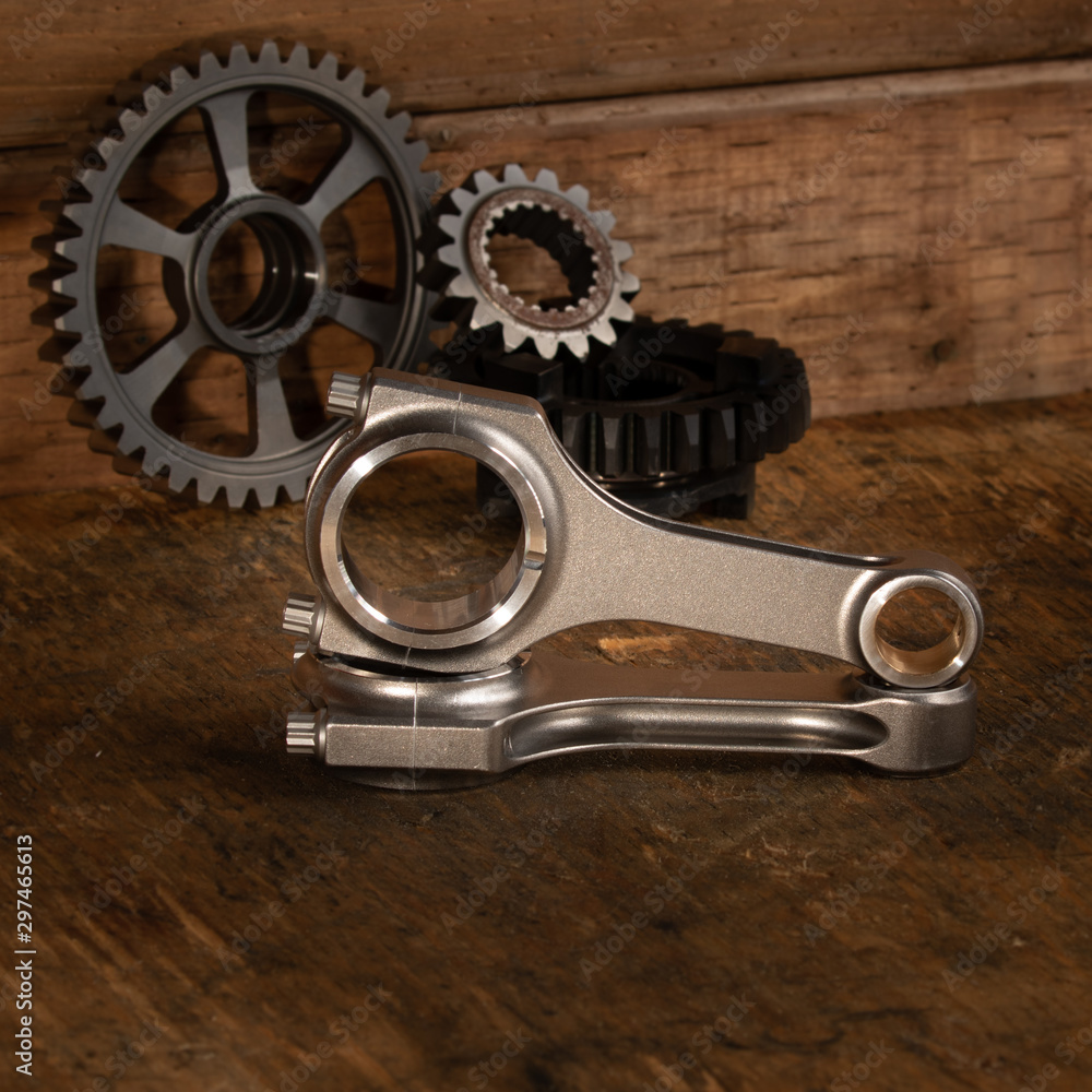 motorcycle engine parts on a workbench with some tools motorcycle engine parts on a workbench with some tools
