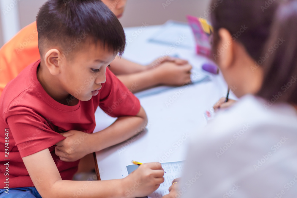 Asian elementary school children are studying in the classroom. Asian elementary school children are studying in the classroom.