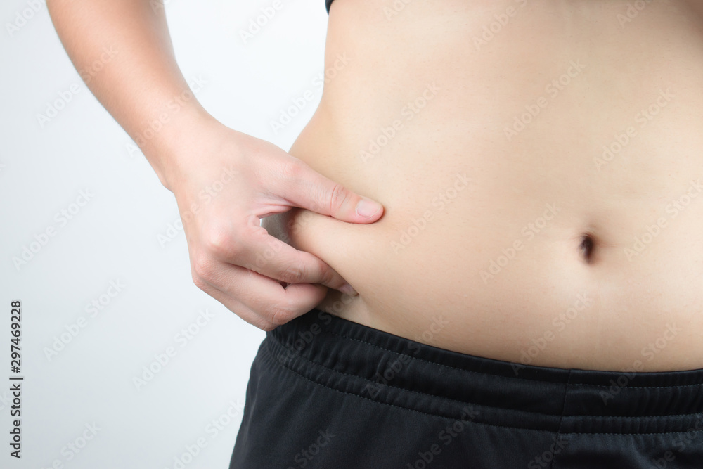Asian obese women are overweight. Show excess fat on the waist. Isolated on white background. Asian obese women are overweight. Show excess fat on the waist. Isolated on white background.