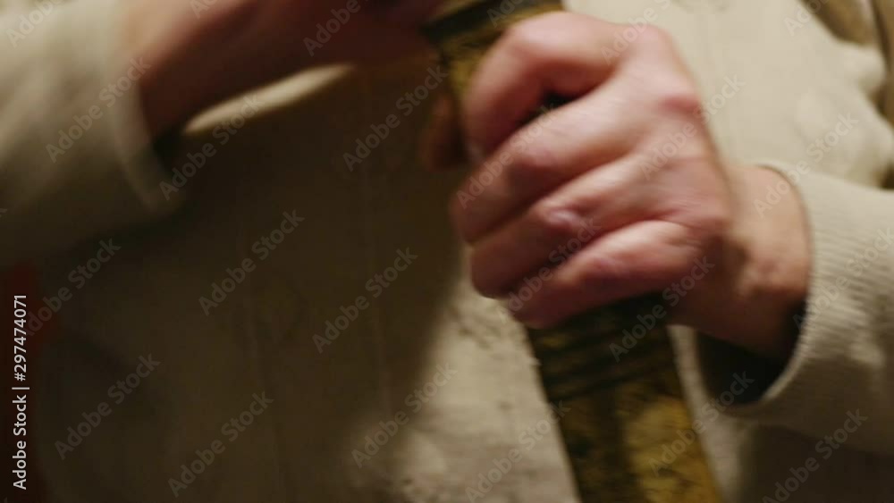 Woman with hand mill for spices Woman with hand mill for spices