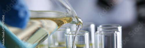 Fényképezés Yellow liquid spilled petrol additive innovative supply