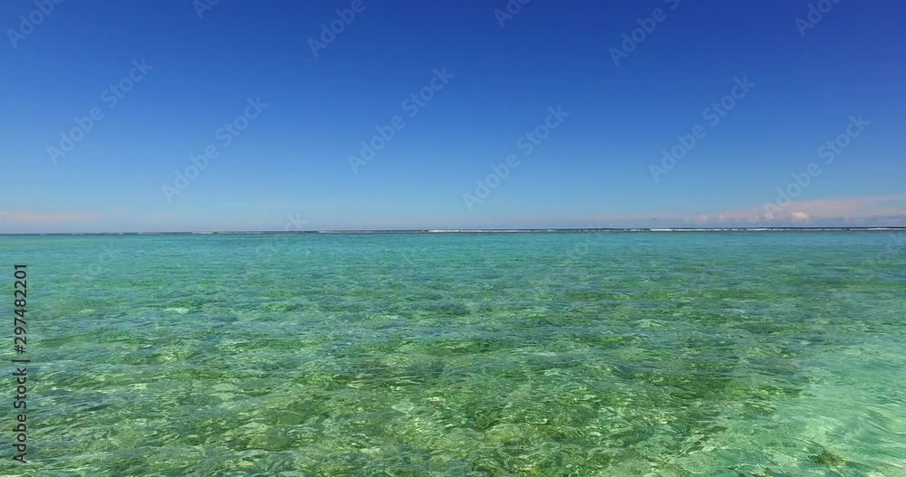 Tropical scenery from Hawaii, clear blue sky from transparent aquamarine water Tropical scenery from Hawaii, clear blue sky from transparent aquamarine water