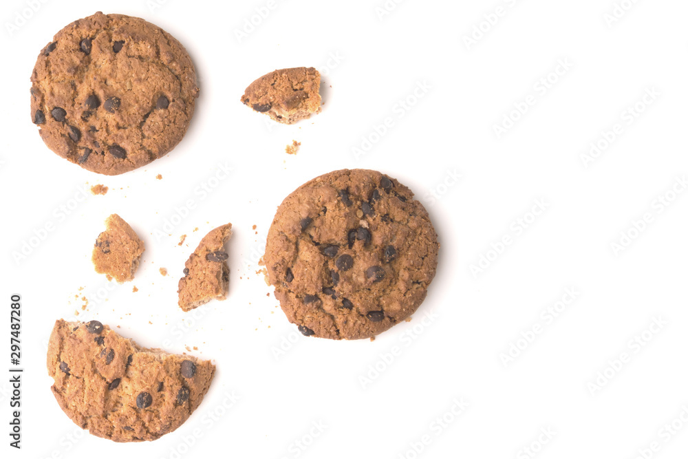 Sweet cookies with raisins isolated on a white background. Whole cookies and pieces and crumbs of cookies. Sweet cookies with raisins isolated on a white background. Whole cookies and pieces and crumbs of cookies.