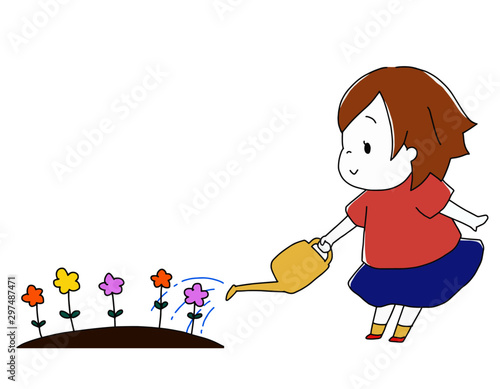 じょうろを持って花に水やりをする女の子