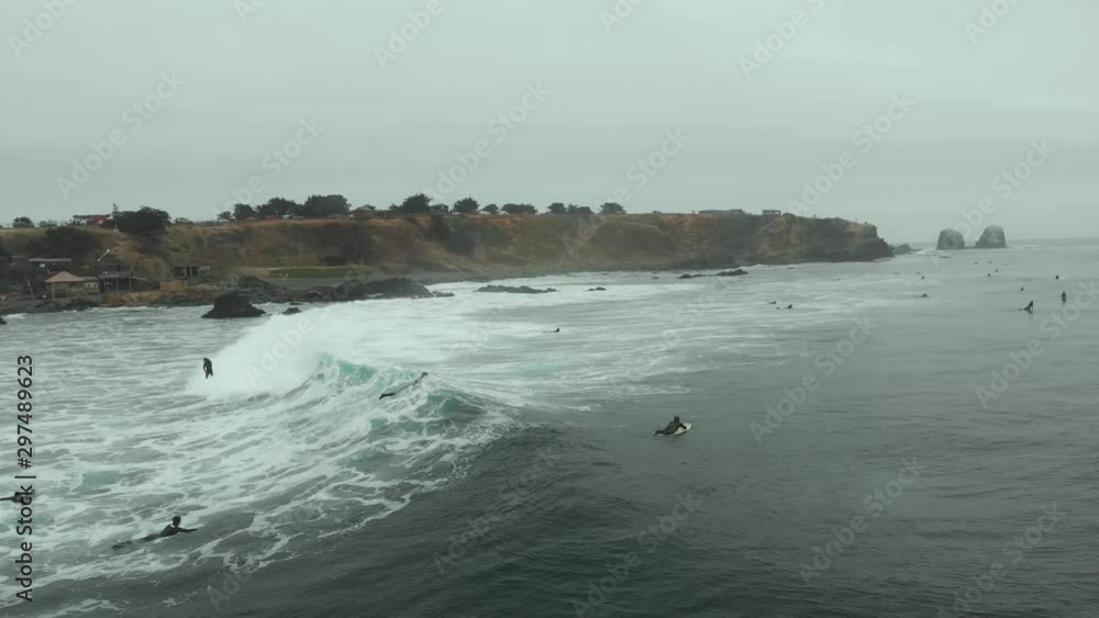 Aerial following surfer riding wave of foam at high speed, Pichilemu, Chile-4K Aerial following surfer riding wave of foam at high speed, Pichilemu, Chile-4K